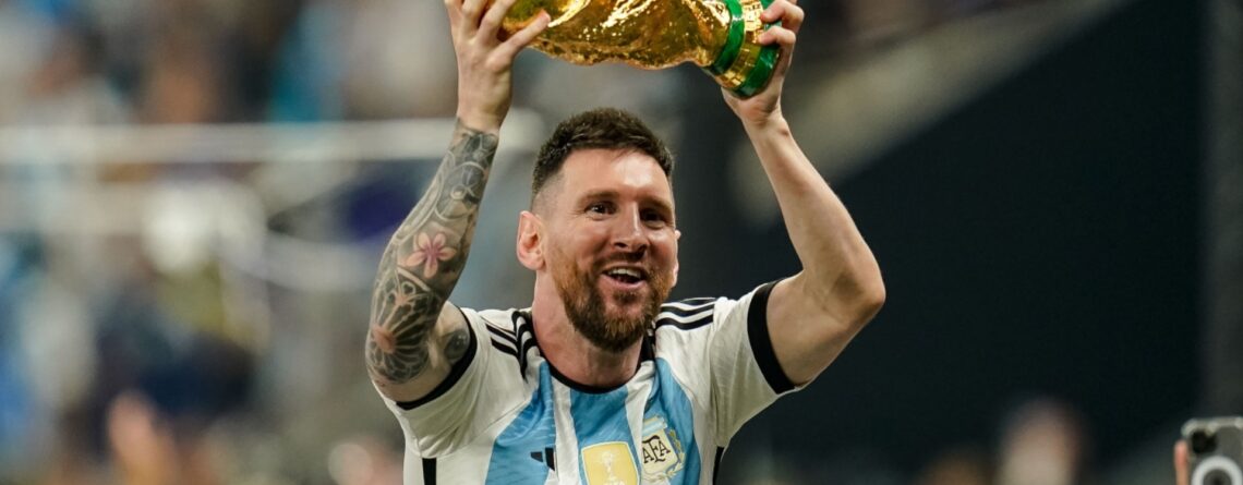 Lionel Messi with FIFA World Cup Trophy